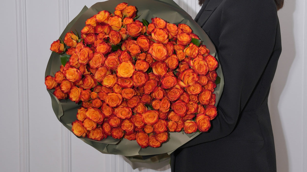 Low terracotta rose centerpiece on an autumn dinner table by Ecoroses, a Los Angeles florist