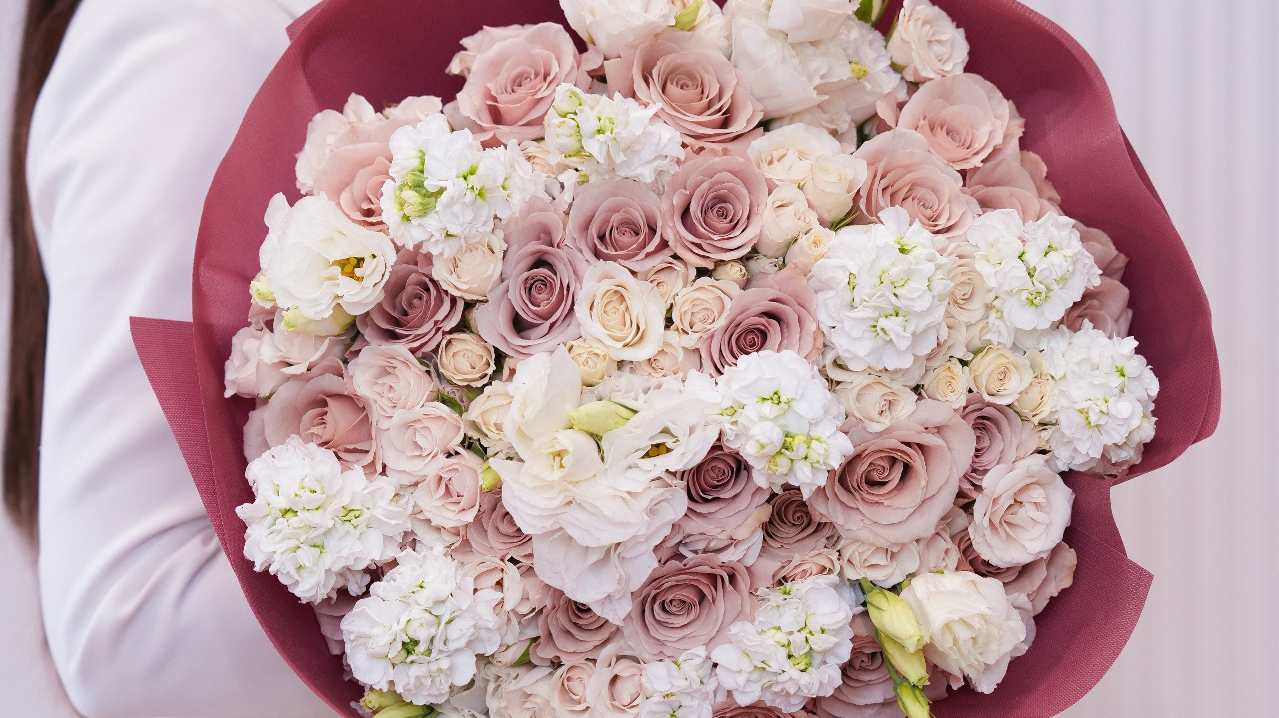 Cream and blush apology rose bouquet hand-tied by Ecoroses, a Los Angeles florist