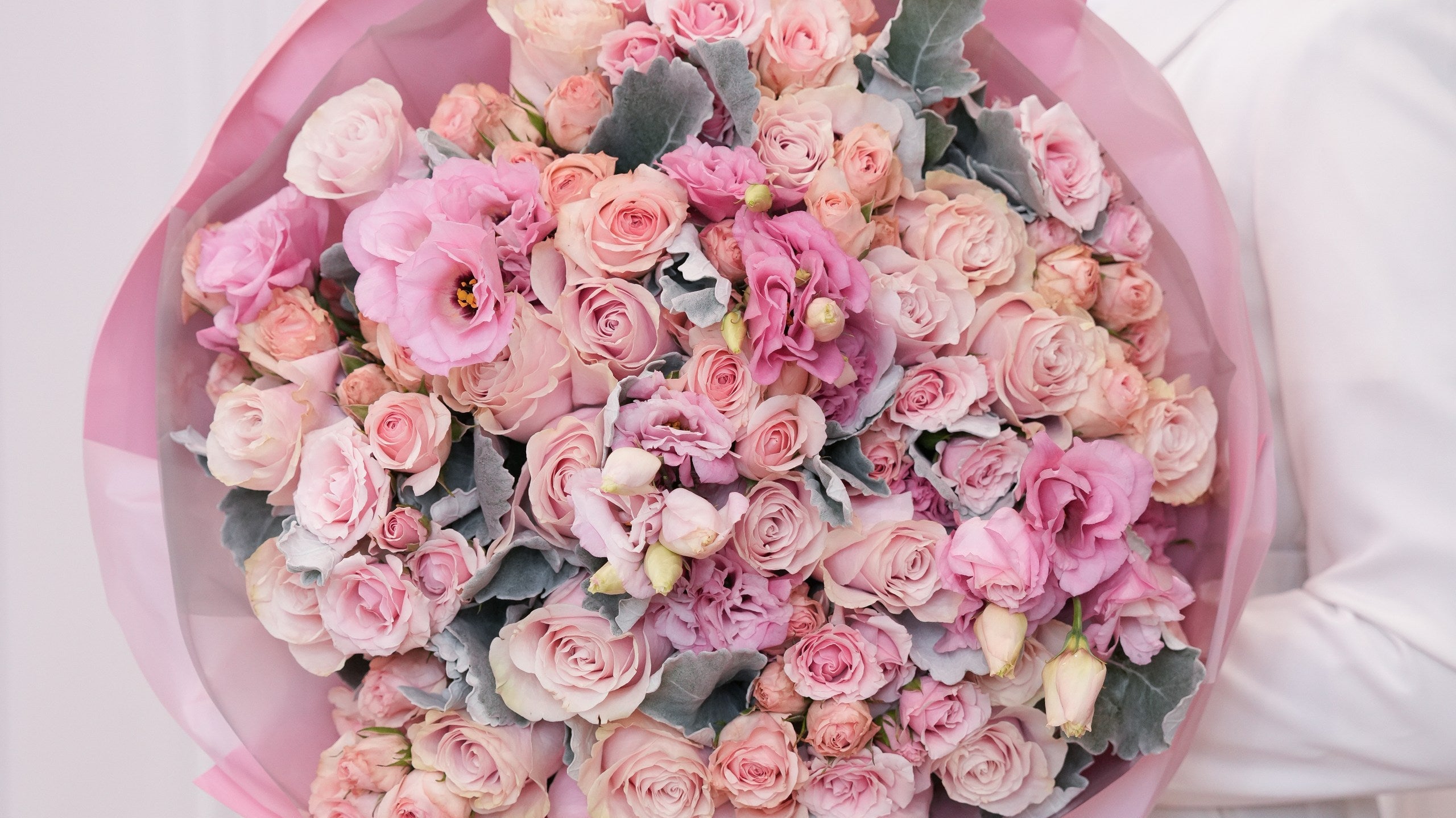 Fresh hand-tied rose bouquet in a clean vase by Ecoroses, a Los Angeles florist