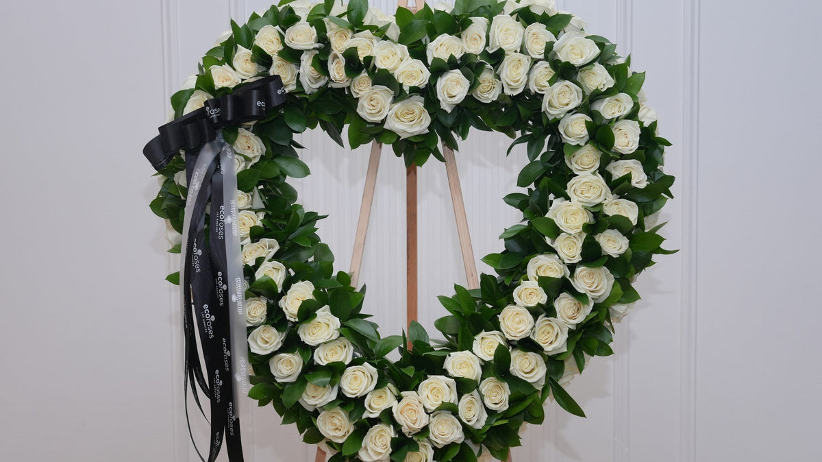 White and cream sympathy arrangement for a colleague, hand-tied by Ecoroses, a Los Angeles florist