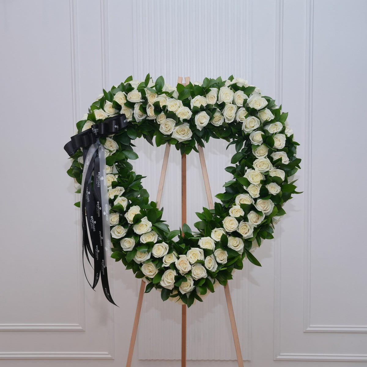 White and cream sympathy arrangement for a colleague, hand-tied by Ecoroses, a Los Angeles florist