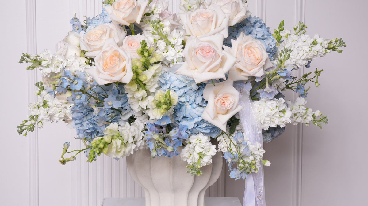 Statement rose arrangement at a boutique grand opening by Ecoroses, a Los Angeles florist