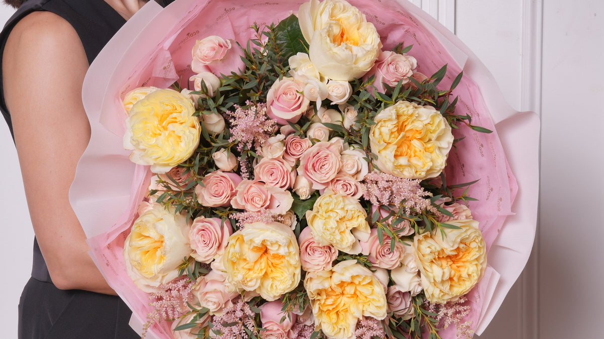 Peach garden roses and classic roses side by side, hand-tied by Ecoroses, a Los Angeles florist