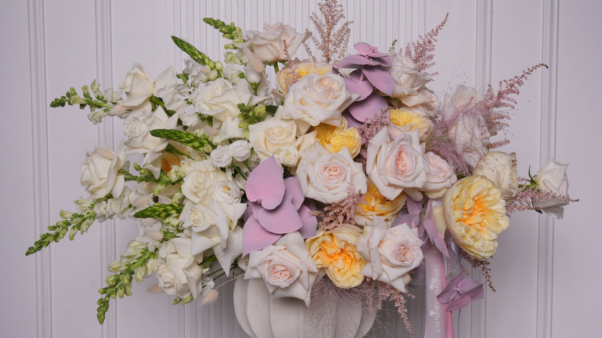 Cream and peach rose arrangements prepared for corporate holiday gifting by Ecoroses, a Los Angeles florist