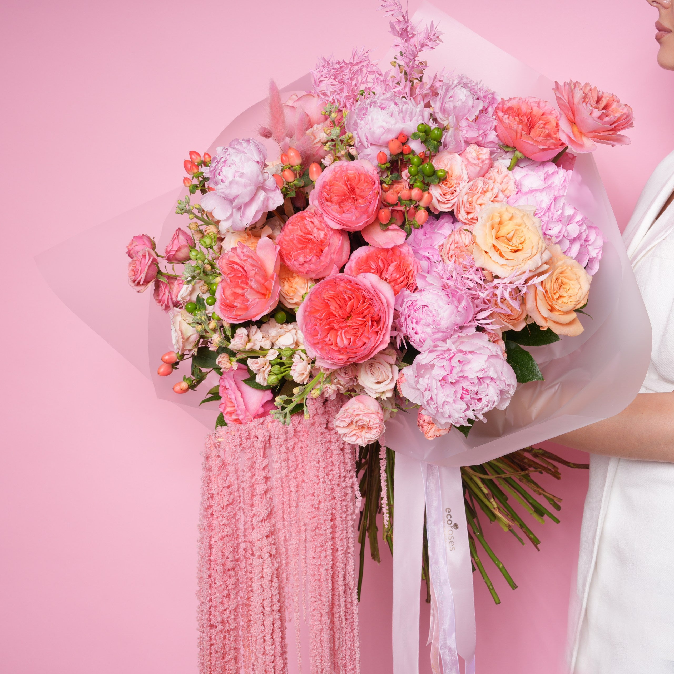 Coralia couture bouquet — coral Corazon baby roses, pink peonies, and hydrangea with preserved amaranthus in a full-scale hand-tied arrangement | Ecoroses Los Angeles