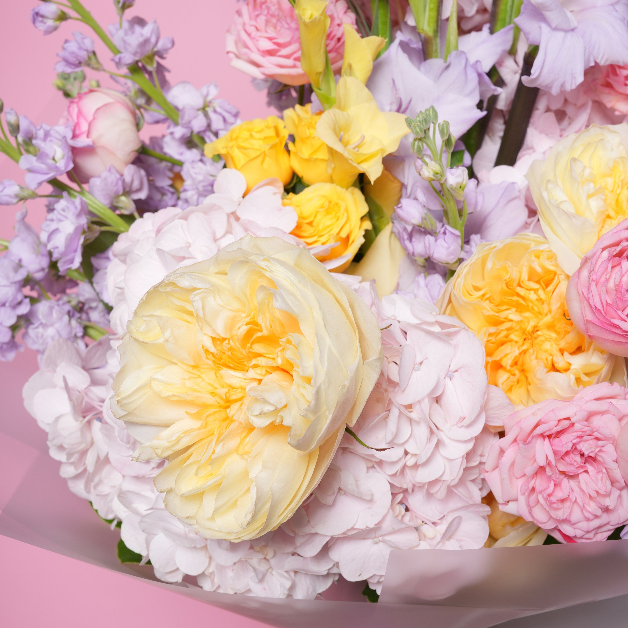 Nicoletta couture bouquet — detail of pink hydrangea with yellow baby roses and purple gladiolus | Ecoroses Los Angeles