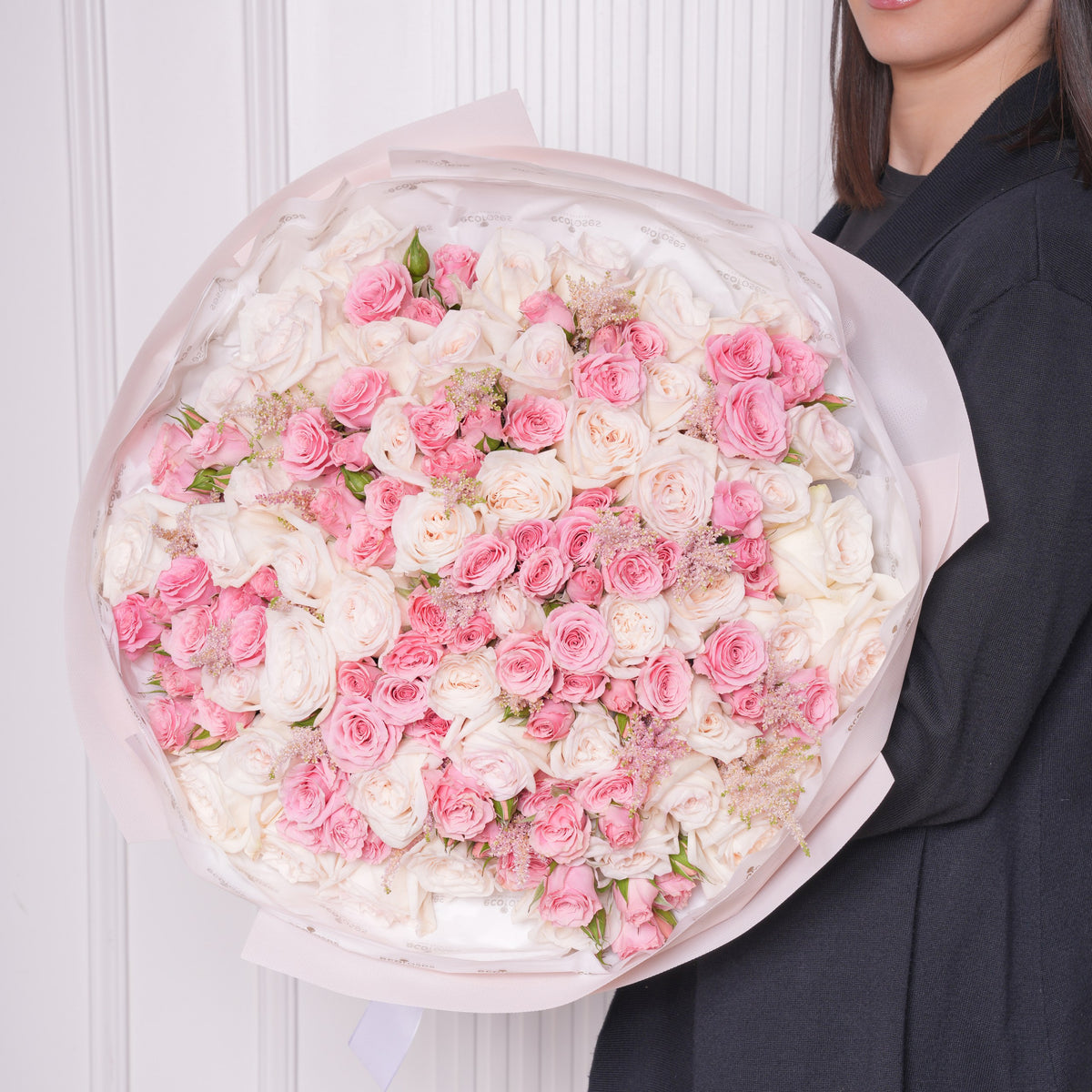 Flavia bouquet — fifty white Ohara garden roses with pink baby roses and feathered astilbe, hand-tied | Ecoroses Los Angeles