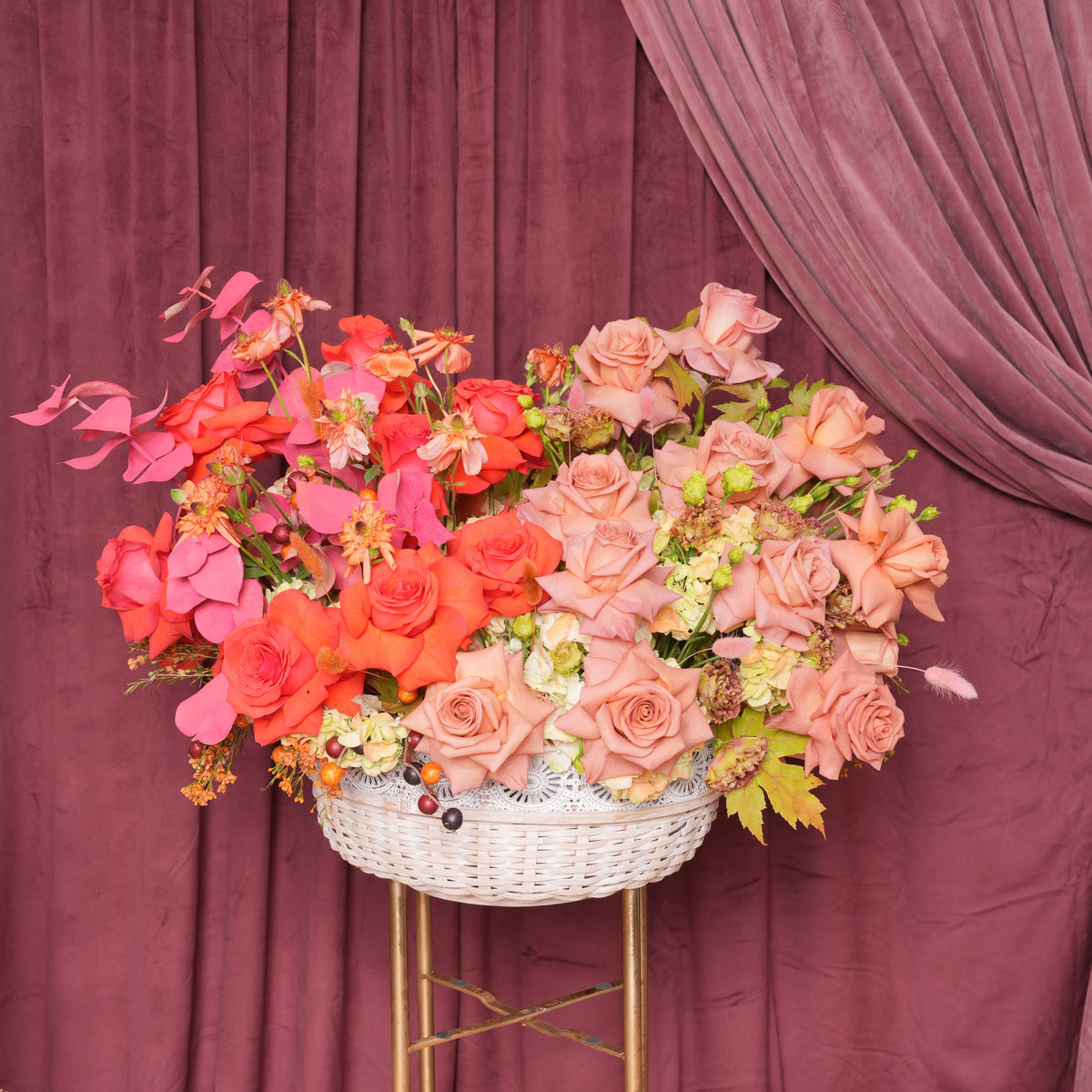 Annetta luxury basket arrangement — coral and terracotta roses, ranunculus, burgundy lisianthus and green hydrangea | Ecoroses Los Angeles