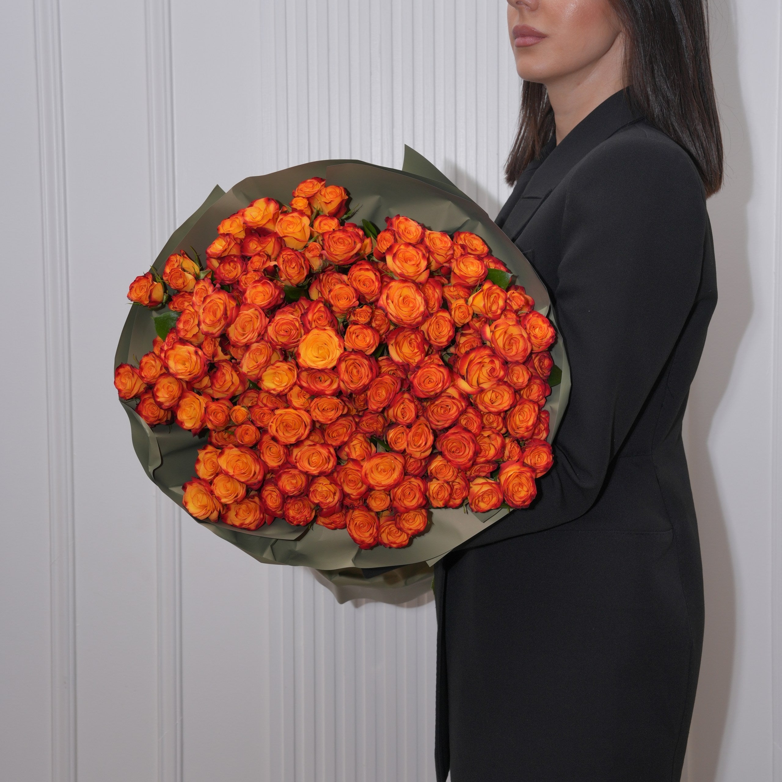 Low terracotta rose centerpiece on an autumn dinner table by Ecoroses, a Los Angeles florist