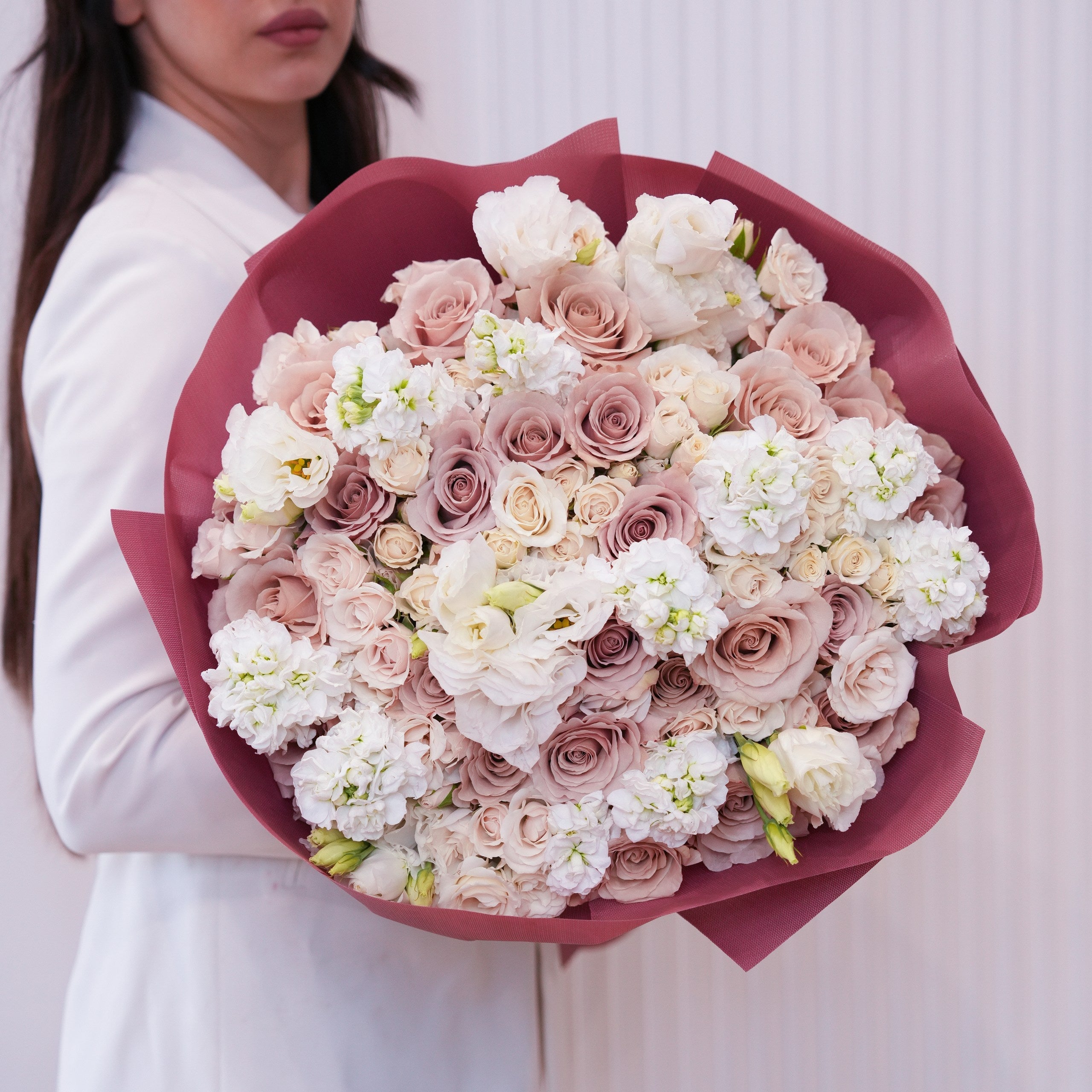 Cream and blush apology rose bouquet hand-tied by Ecoroses, a Los Angeles florist