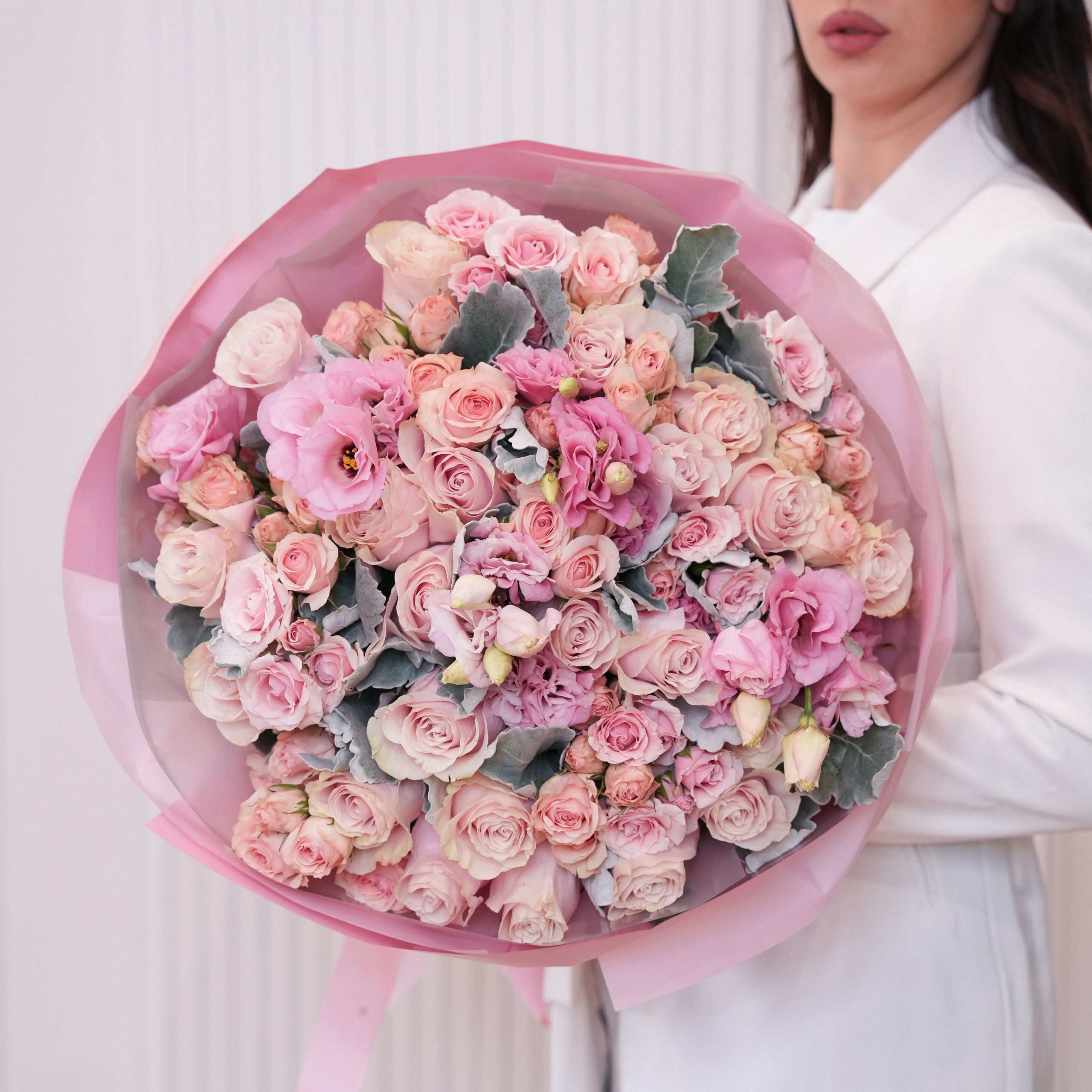 Fresh hand-tied rose bouquet in a clean vase by Ecoroses, a Los Angeles florist