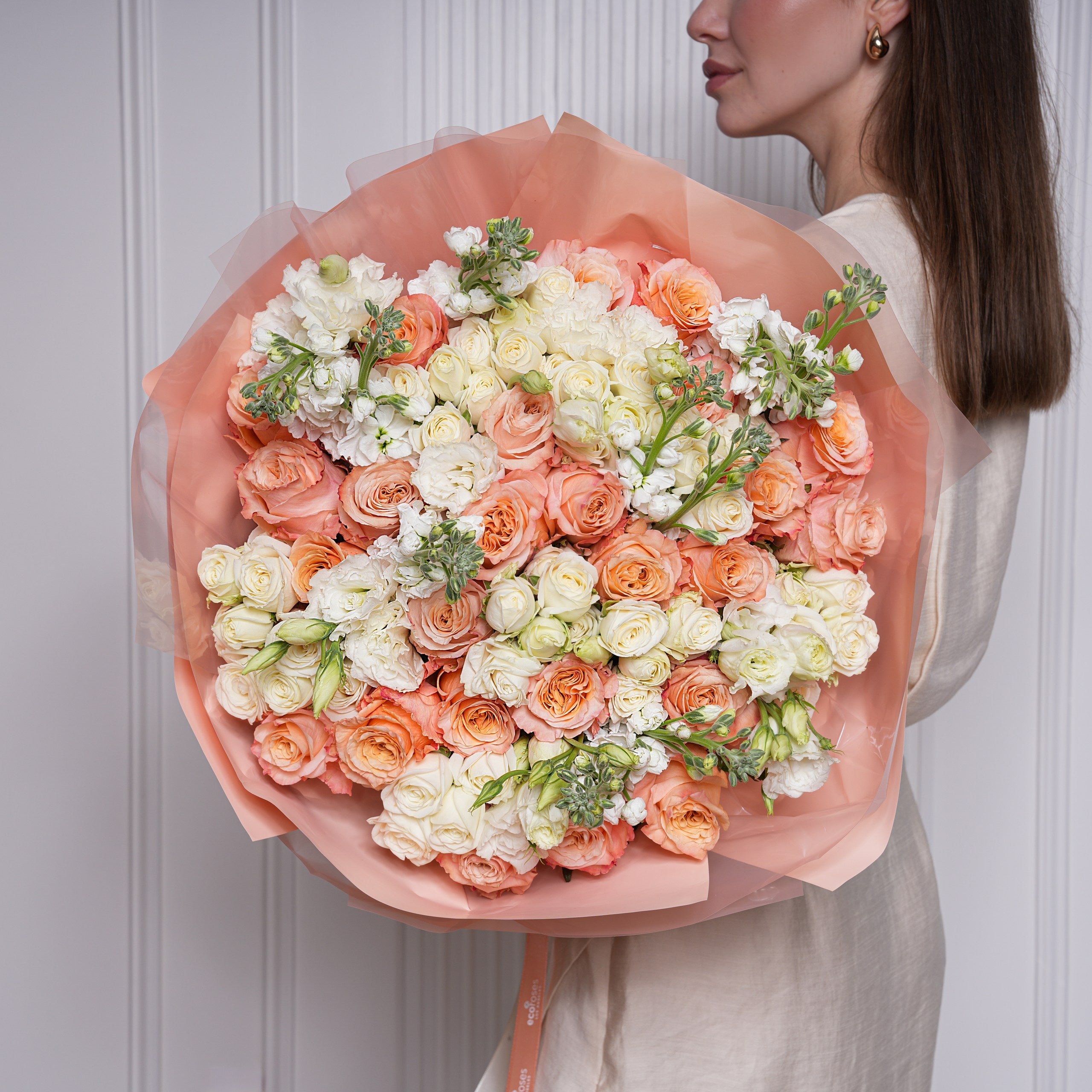 Bright orange and coral summer rose bouquet hand-tied by Ecoroses, a Los Angeles florist