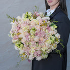 Mirabella luxury bouquet — peach Garden Spirit roses, star baby roses, yellow lisianthus, and stock in a hand-tied garden-style arrangement | Ecoroses Los Angeles