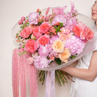Coralia couture bouquet — detail of coral and blush garden roses layered with peonies and hypericum berries | Ecoroses Los Angeles