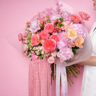 Coralia couture bouquet — coral Corazon baby roses, pink peonies, and hydrangea with preserved amaranthus in a full-scale hand-tied arrangement | Ecoroses Los Angeles