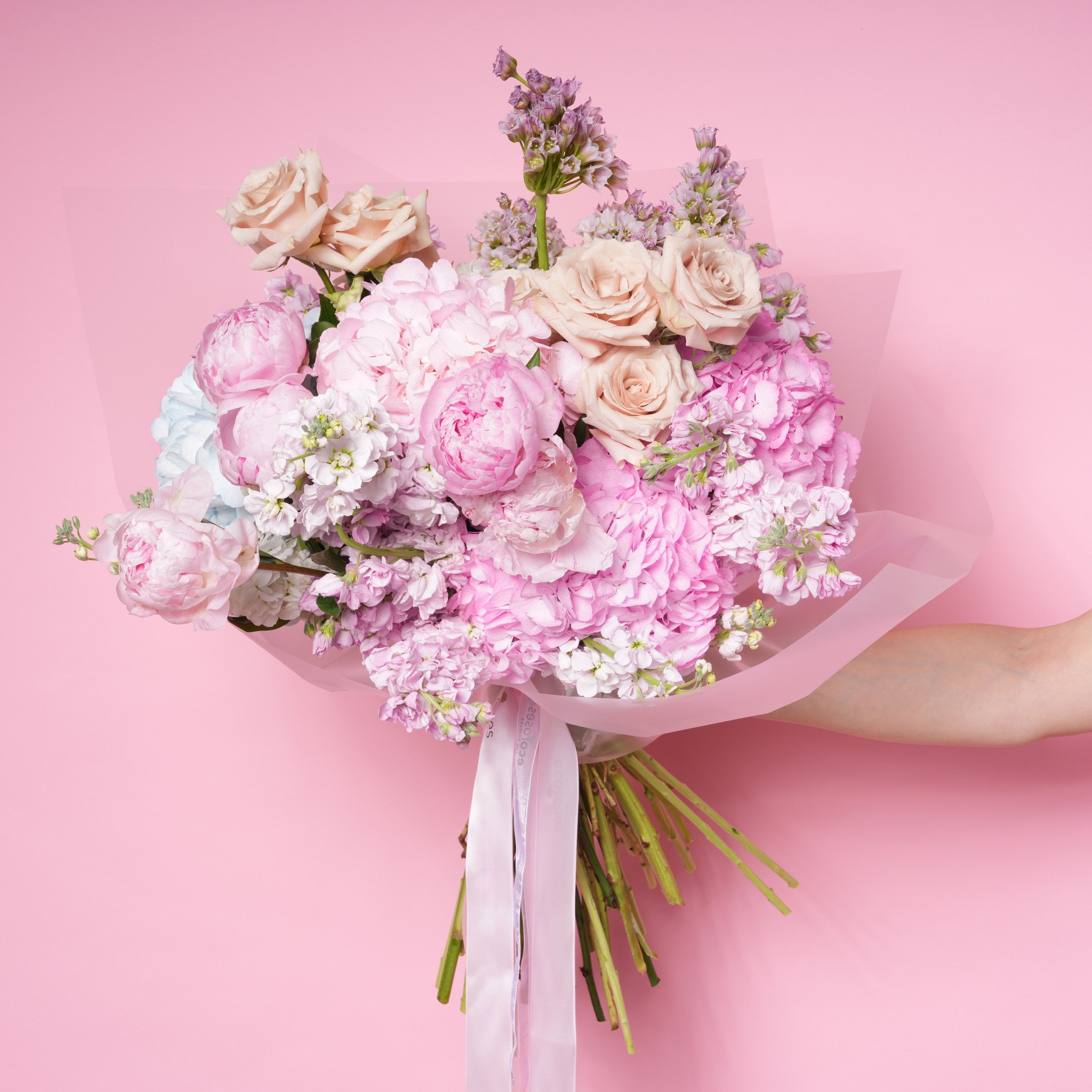 Malvina luxury bouquet — detail of mauve roses and purple allium against soft cream stock | Ecoroses Los Angeles