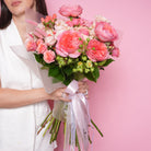 Bellarosa luxury bouquet — Princess Crown and Mandarin roses with pink baby roses and peach stock in a soft tonal hand-tied arrangement | Ecoroses Los Angeles