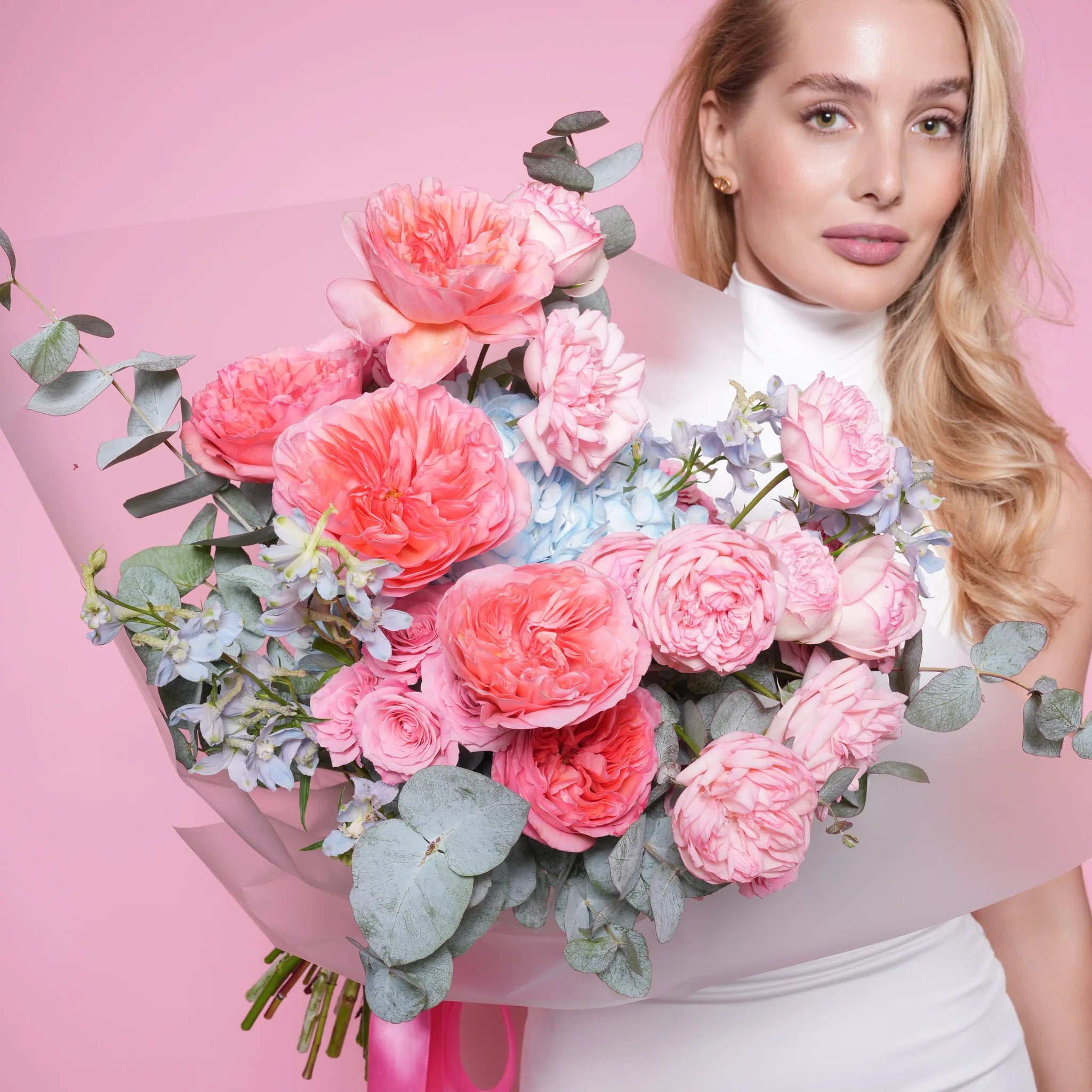 Edda couture bouquet — blue hydrangea with Pink Expression and Bridal Piano roses, delphinium, and dusty miller in a cool romantic hand-tied arrangement | Ecoroses Los Angeles