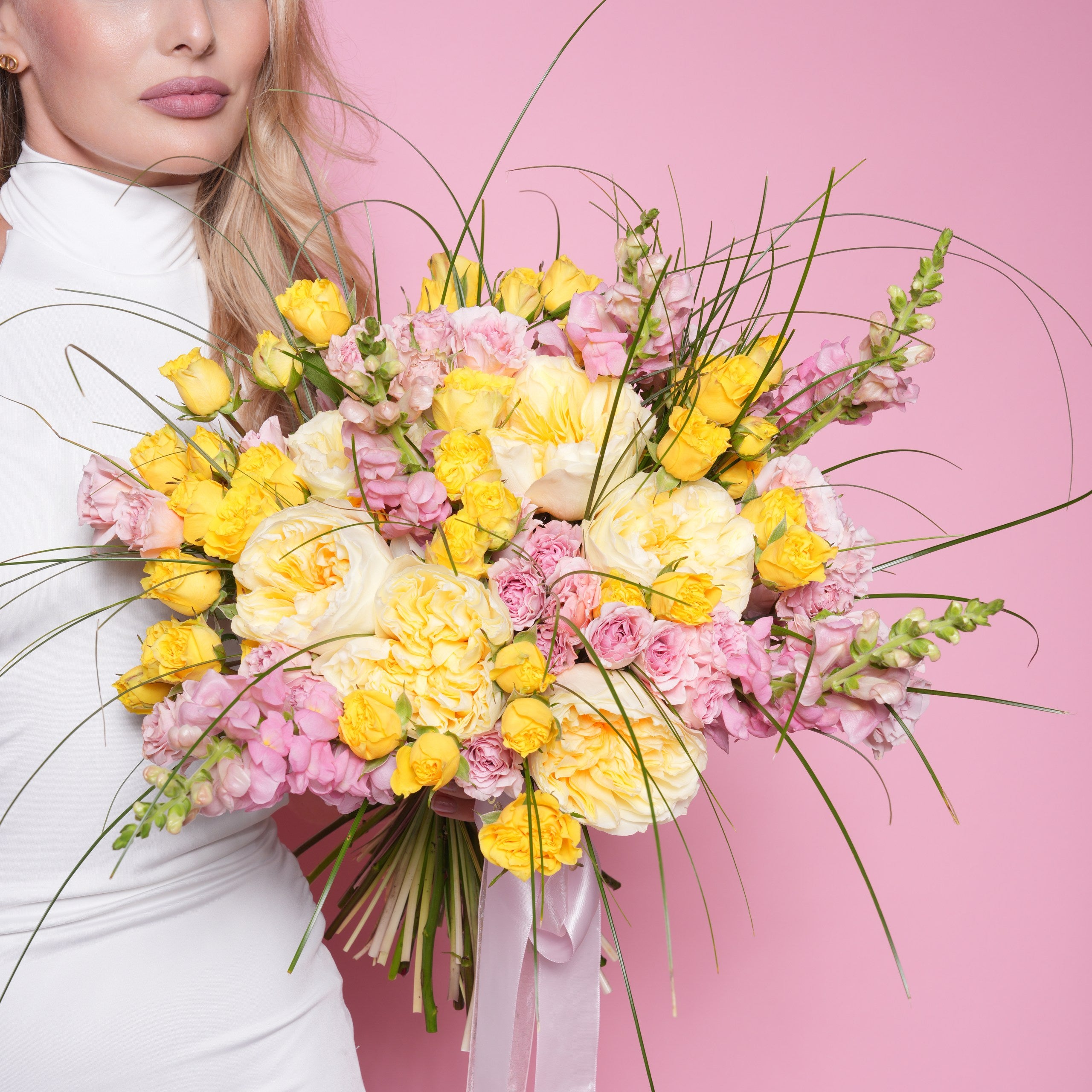 Ilaria couture bouquet — yellow and pink baby roses with garden roses, snapdragon, and bear grass in a bright hand-tied arrangement | Ecoroses Los Angeles