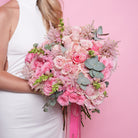 Rosalba couture bouquet — Pink Mondial roses with pink baby roses, astilbe, and snapdragon in a soft textural hand-tied arrangement | Ecoroses Los Angeles