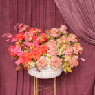 Annetta luxury basket arrangement — coral and terracotta roses, ranunculus, burgundy lisianthus and green hydrangea | Ecoroses Los Angeles