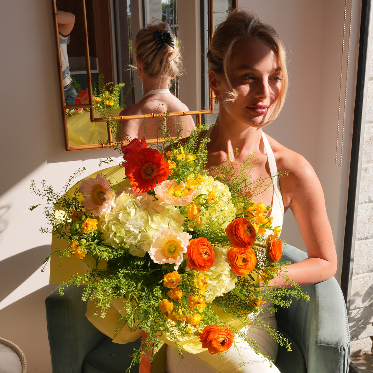 Clementina luxury bouquet — orange and yellow ranunculus, orange and peach poppies and green hydrangea in a hand-tied arrangement | Ecoroses Los Angeles