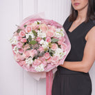 Nina bouquet — pink Mondial roses with blush baby roses, stock, and seeded eucalyptus, hand-tied | Ecoroses Los Angeles