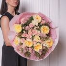 Antonia couture bouquet — cream garden roses and Mondial roses with ivory baby roses and feathered astilbe, hand-tied | Ecoroses Los Angeles