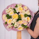 Oriana couture bouquet — Fatima garden roses in warm apricot with yellow stock and green coffee bean foliage, hand-tied | Ecoroses Los Angeles