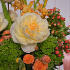 Livia couture arrangement — detail of green hydrangea with orange gladiolus and coffee bean foliage | Ecoroses Los Angeles
